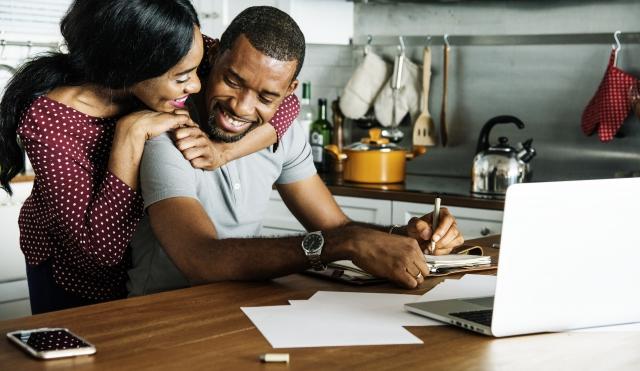 Couple happy at computer