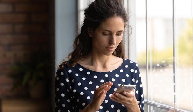 woman looking at phone