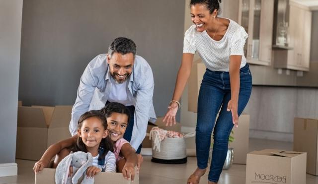 Family having fun in new house