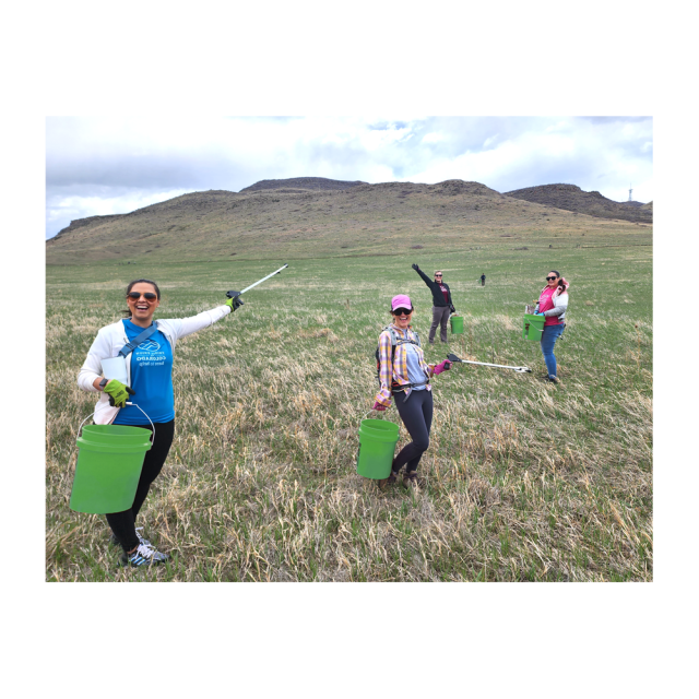 a group of volunteers pose during a park clean up