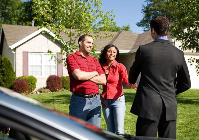 couple outside house