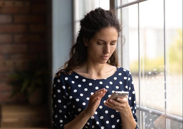 woman looking at phone