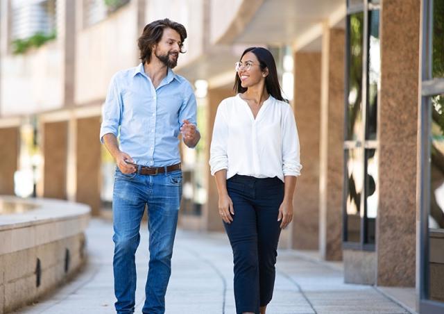 Friends walking by building